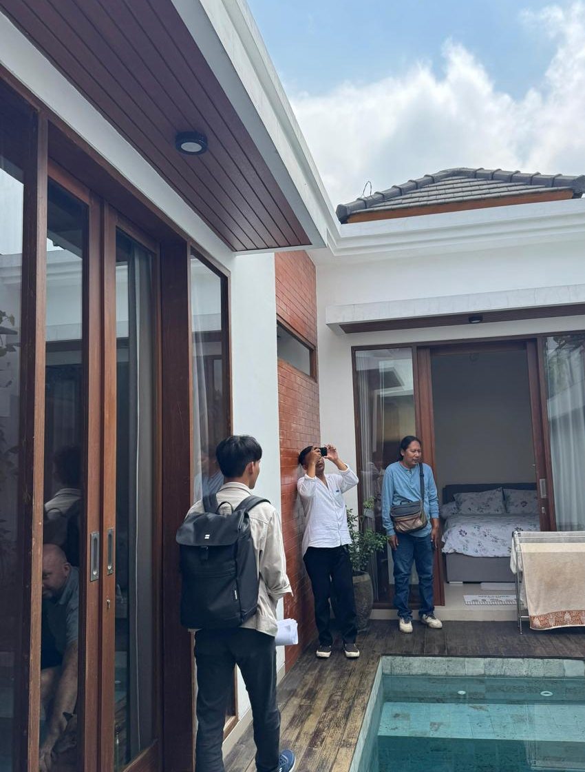 Architectural team observing existing building conditions around a courtyard.